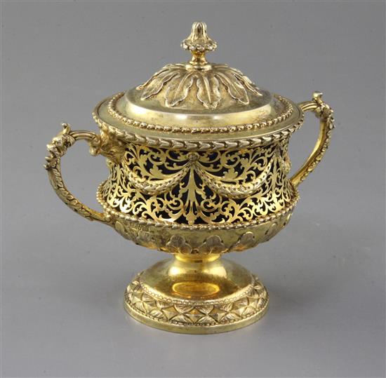 An Edwardian silver gilt two handled pedestal cup and cover by Nathan & Hayes, 12 oz.